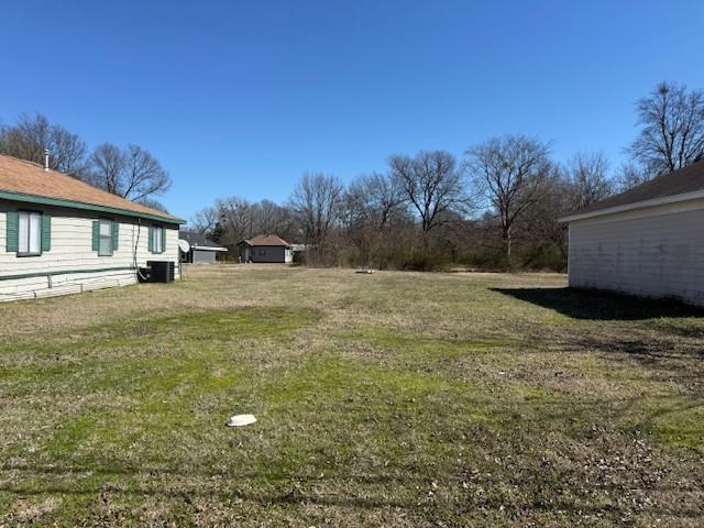 1620 Fitzhugh Avenue Paris, TX 75460 - Photo 3 of 15 a view of a yard with an outdoor space