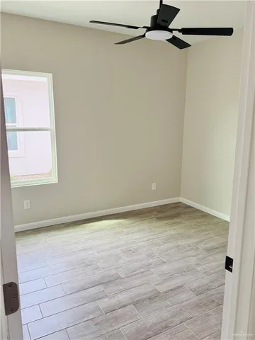 a white toilet sitting next to a bath tub