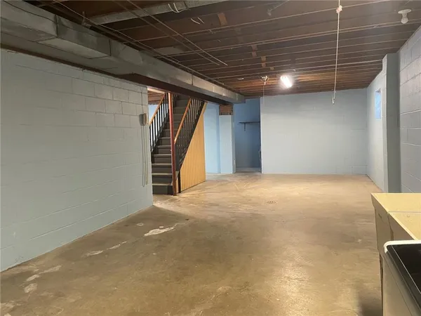 a view of an empty room with a fireplace