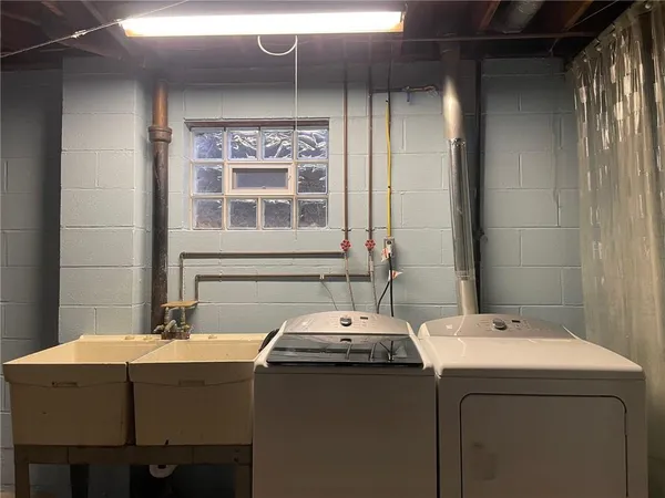 a bathroom with a sink and a window