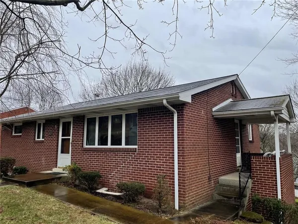 a front view of a house with garage