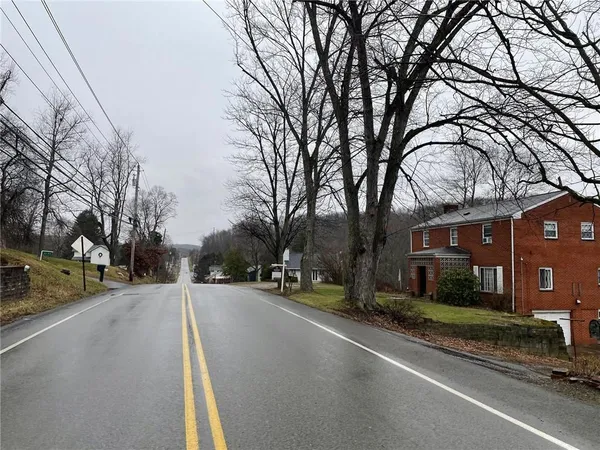 a road view along with residential houses