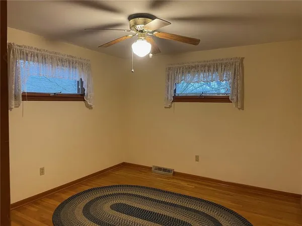 a room with a bed and a chandelier