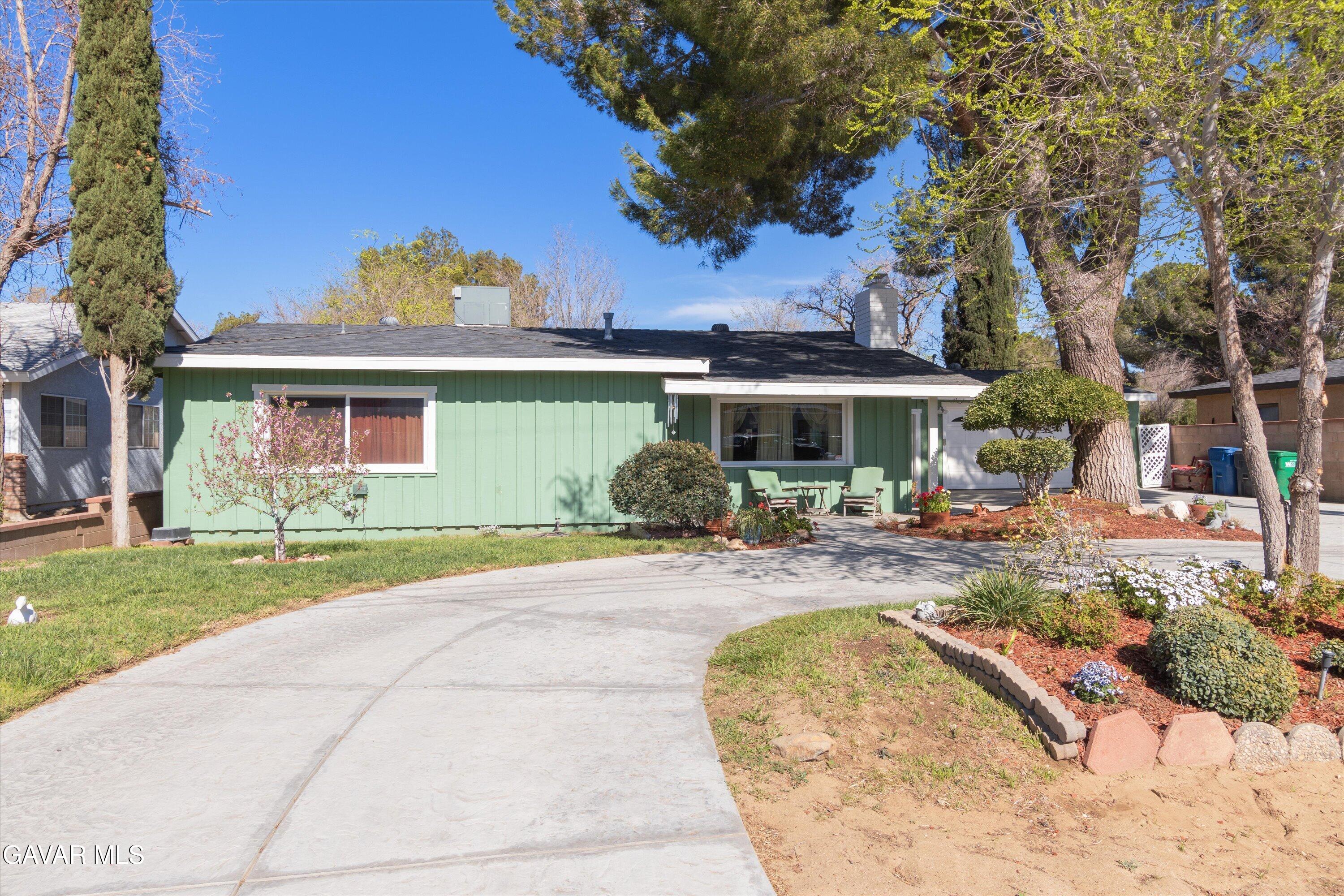 4817 Quartz Hill Road Quartz Hill, CA 93536 - Photo 37 of 41 a view of a house with backyard porch and sitting area
