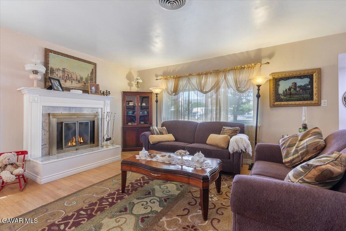 4817 Quartz Hill Road Quartz Hill, CA 93536 - Photo 10 of 41 a living room with furniture and a fireplace