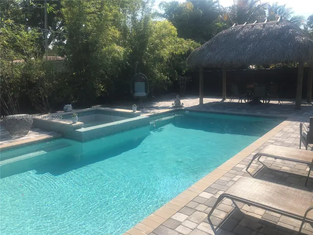 a view of swimming pool with a yard