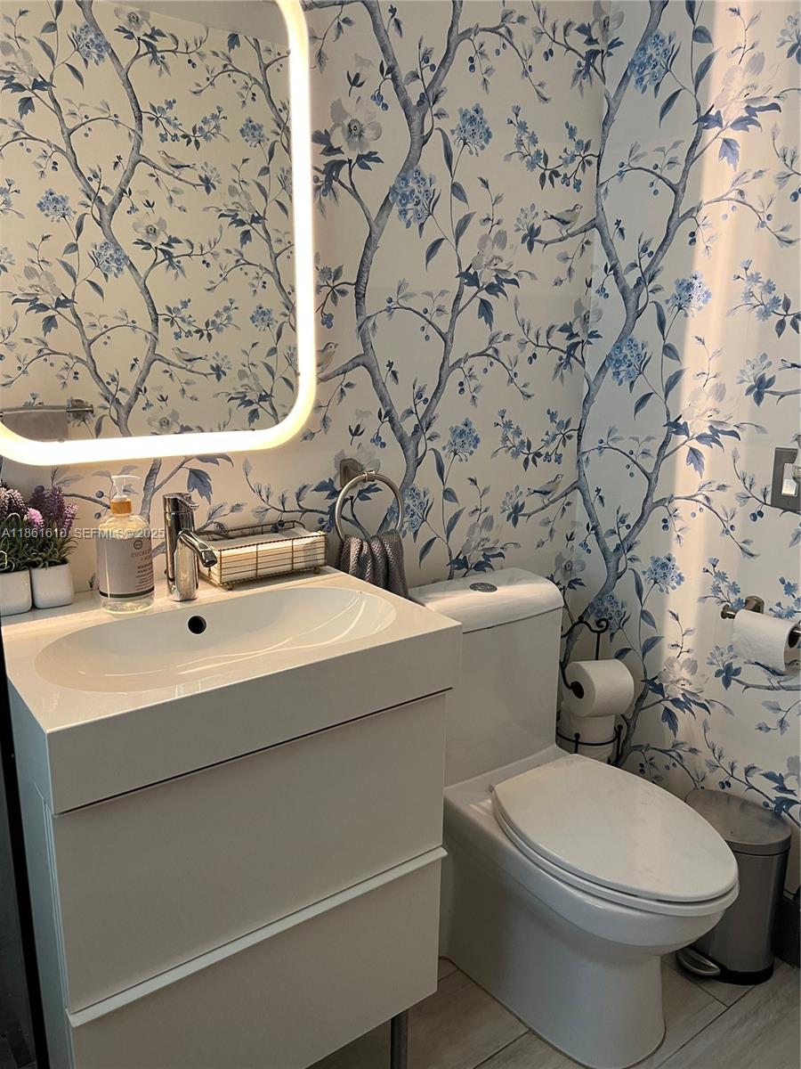 1900 Keystone Boulevard North Miami, FL 33181 - Photo 11 of 14 a bathroom with a sink and a toilet