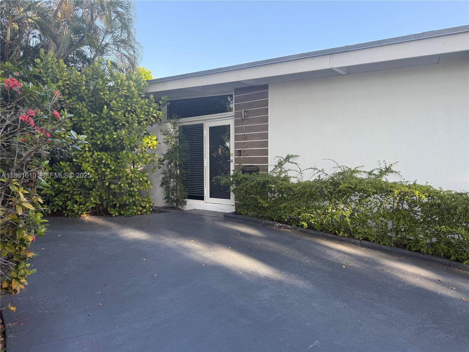 1900 Keystone Boulevard North Miami, FL 33181 - Photo 14 of 14 a view of a house with a street