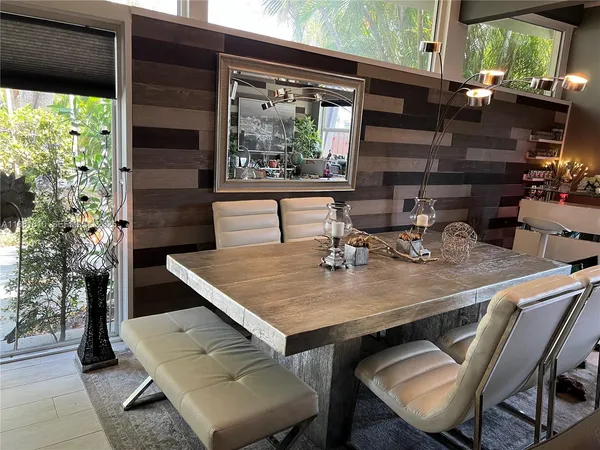 a view of a dining table and chairs in the patio