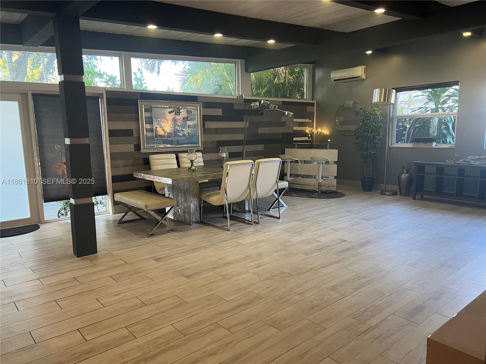 1900 Keystone Boulevard North Miami, FL 33181 - Photo 5 of 14 a room with lots of furniture and a large window