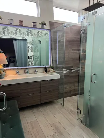 a bathroom with a bathtub and a shower