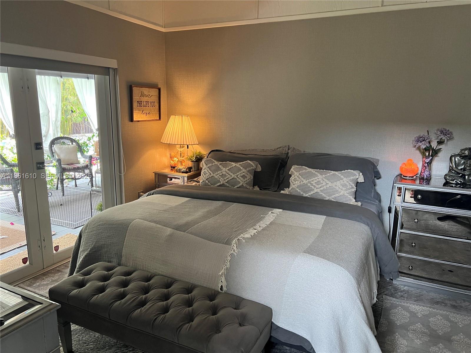 1900 Keystone Boulevard North Miami, FL 33181 - Photo 9 of 14 a bedroom with a bed and window