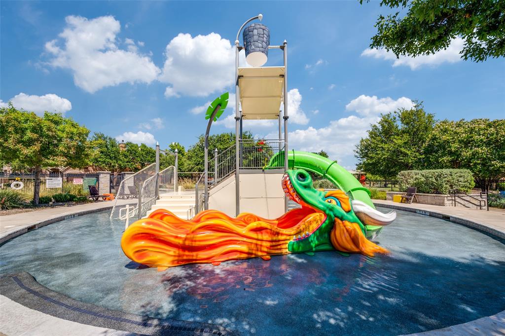 8440 Colburn The Colony, TX 75056 - Photo 29 of 34 The Tribute's neighborhood splash park provides endless fun for children with interactive water features, spray elements, and plenty of space to play and cool off on warm Texas days. This family-friendly amenity is just one of the many reasons residents love the resort-style lifestyle offered in The Tribute.