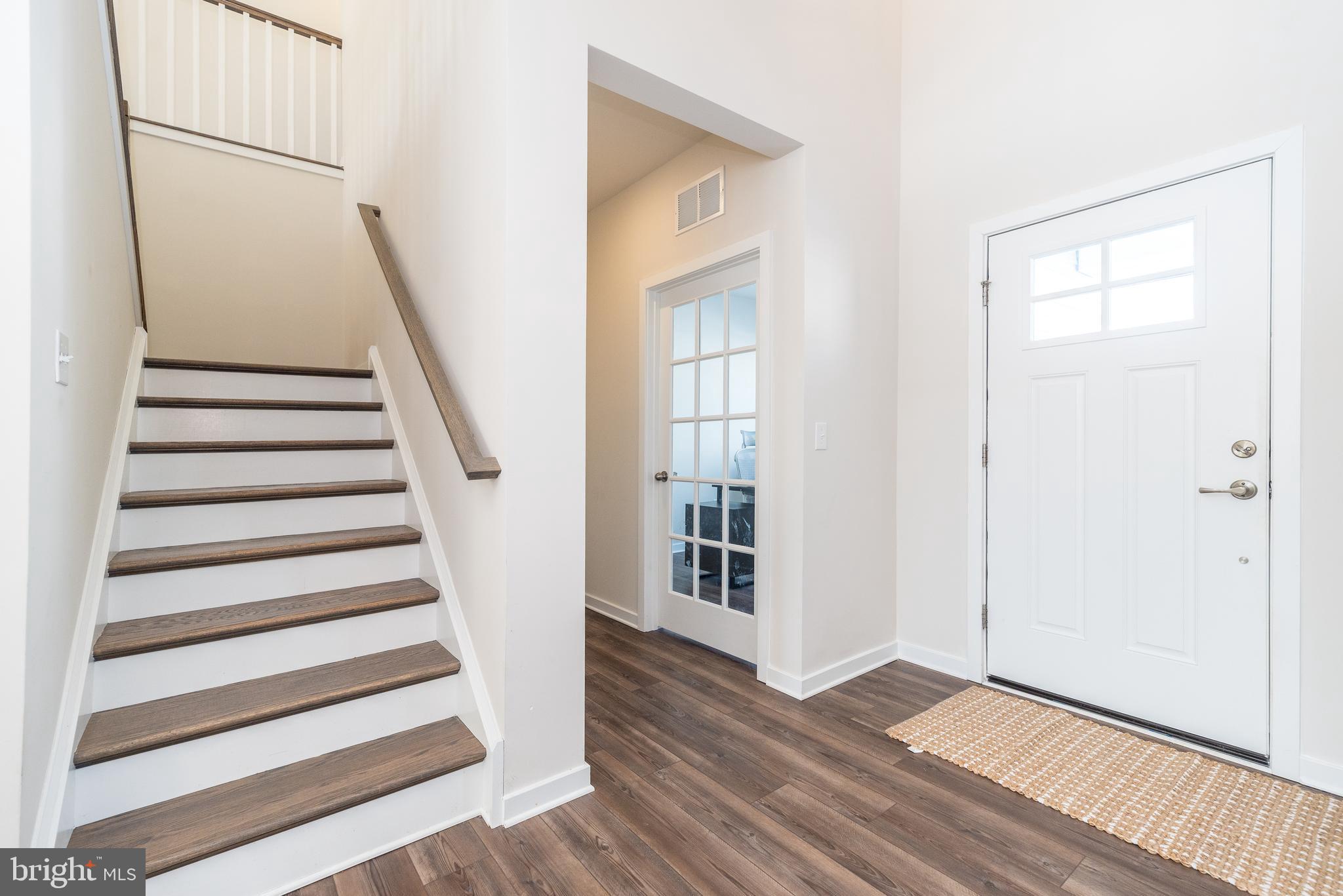 1033 Mariwill Drive Quakertown, PA 18951 - Photo 11 of 67 an empty room with wooden floor and windows