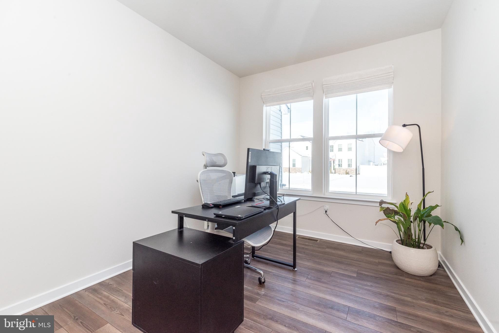 1033 Mariwill Drive Quakertown, PA 18951 - Photo 12 of 67 a workspace with furniture and a potted plant