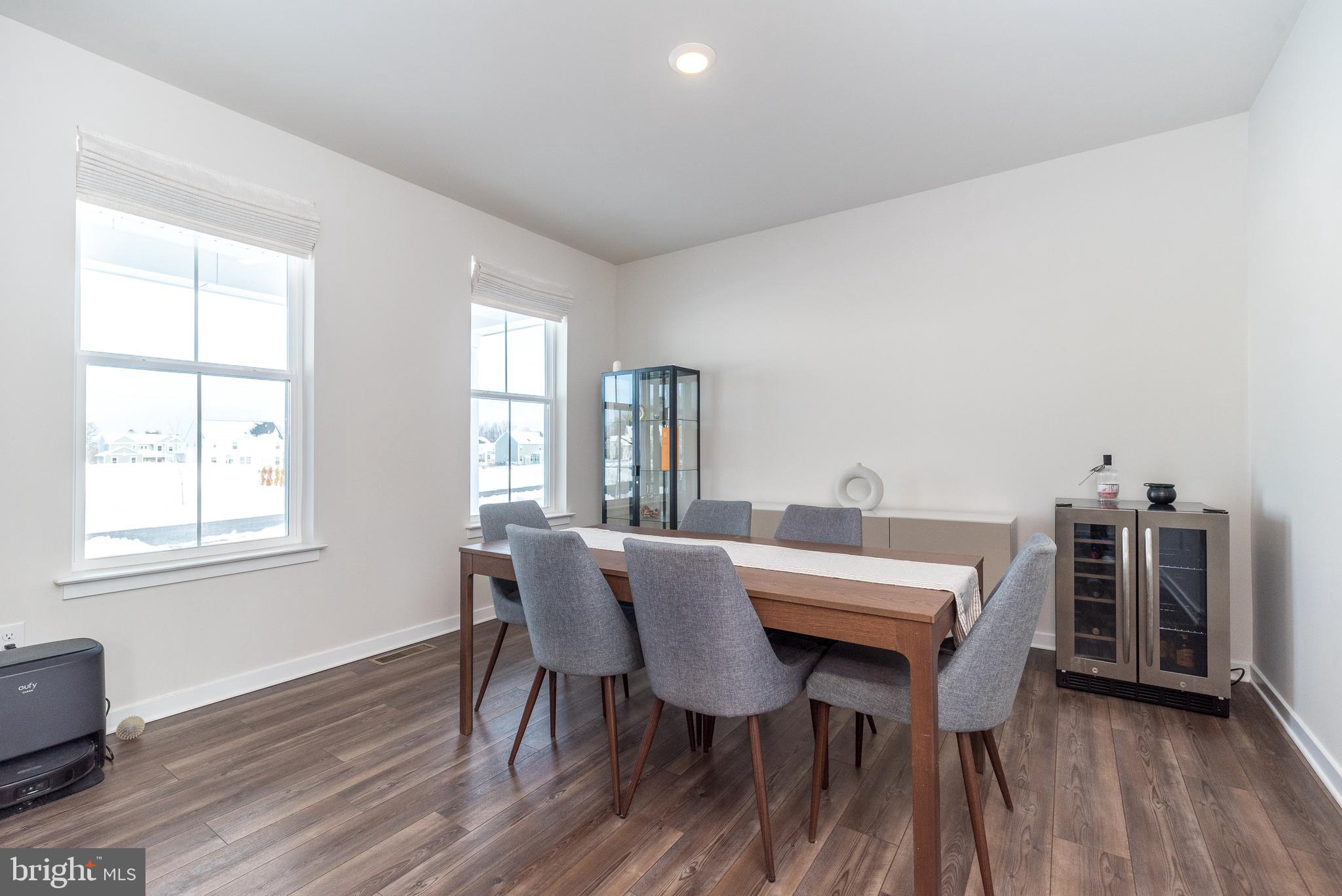 1033 Mariwill Drive Quakertown, PA 18951 - Photo 15 of 67 a view of a dining room with furniture and wooden floor