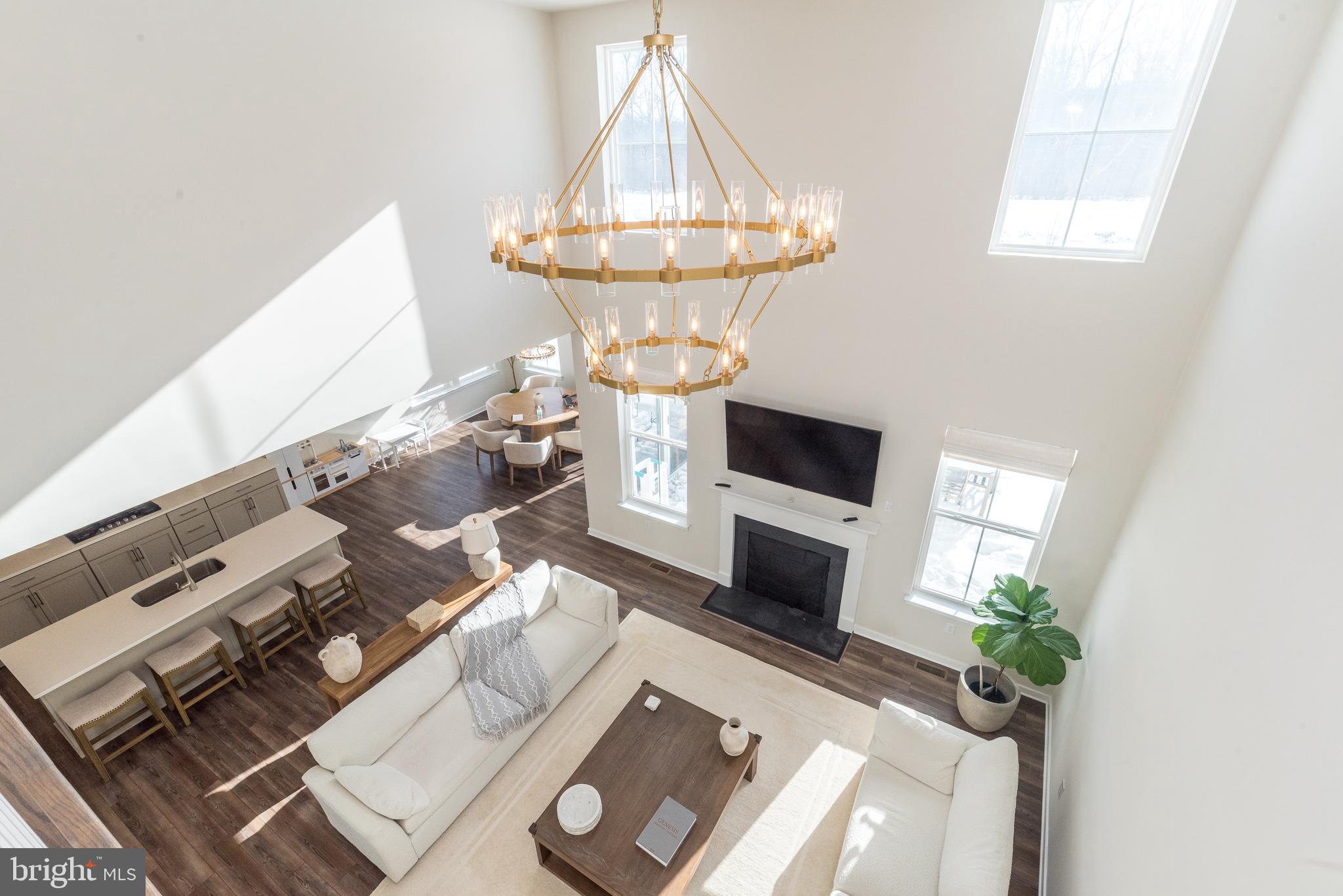 1033 Mariwill Drive Quakertown, PA 18951 - Photo 16 of 67 a living room with furniture a fireplace and a flat screen tv