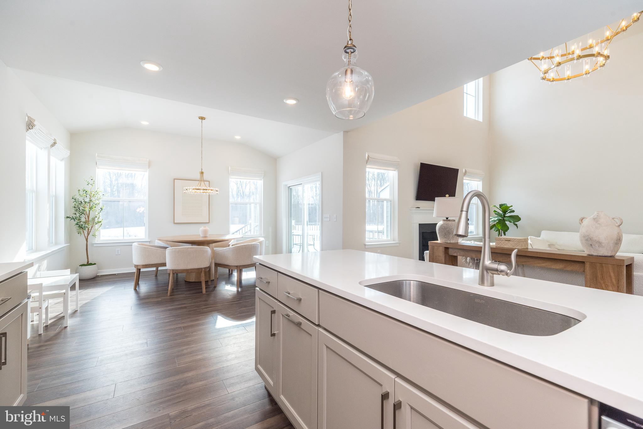 1033 Mariwill Drive Quakertown, PA 18951 - Photo 28 of 67 a view of kitchen island wooden floor and living room