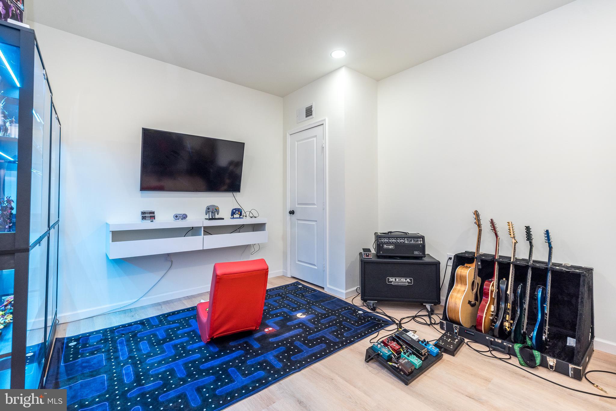 1033 Mariwill Drive Quakertown, PA 18951 - Photo 45 of 67 a living room with furniture and a flat screen tv