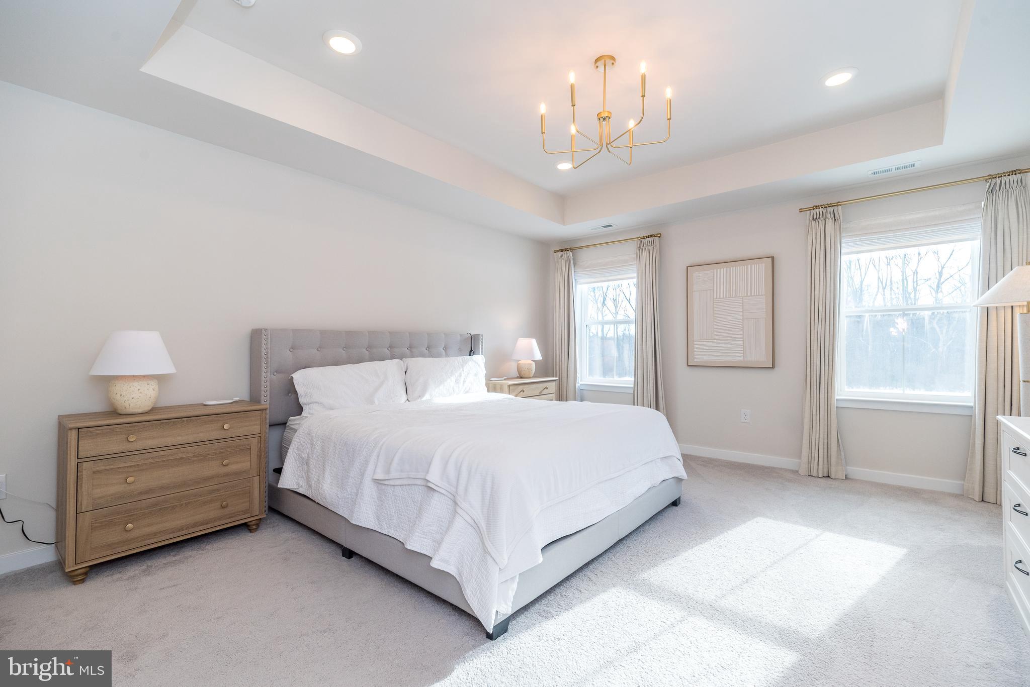 1033 Mariwill Drive Quakertown, PA 18951 - Photo 49 of 67 a spacious bedroom with a bed and a chandelier