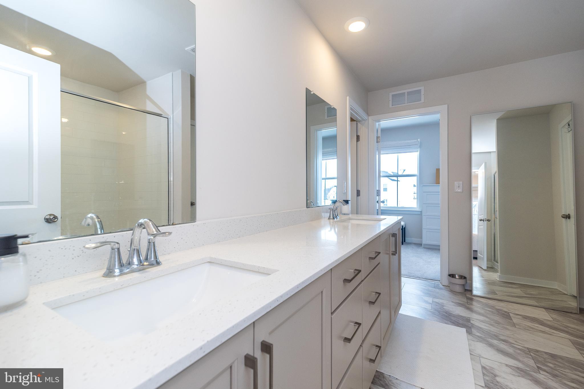 1033 Mariwill Drive Quakertown, PA 18951 - Photo 51 of 67 a bathroom with a granite countertop sink and a mirror