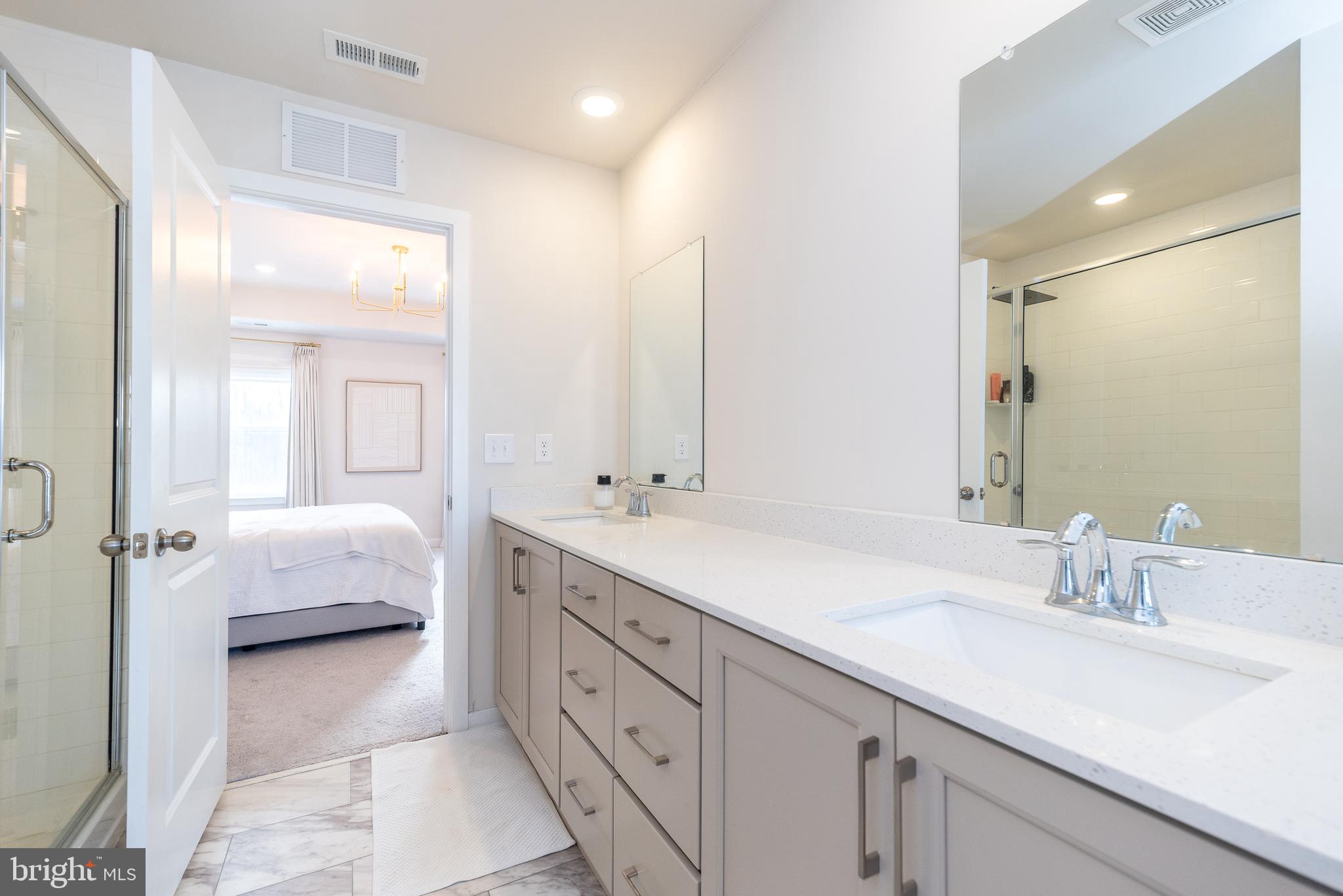 1033 Mariwill Drive Quakertown, PA 18951 - Photo 52 of 67 a en suite bathroom with double sink and a mirror