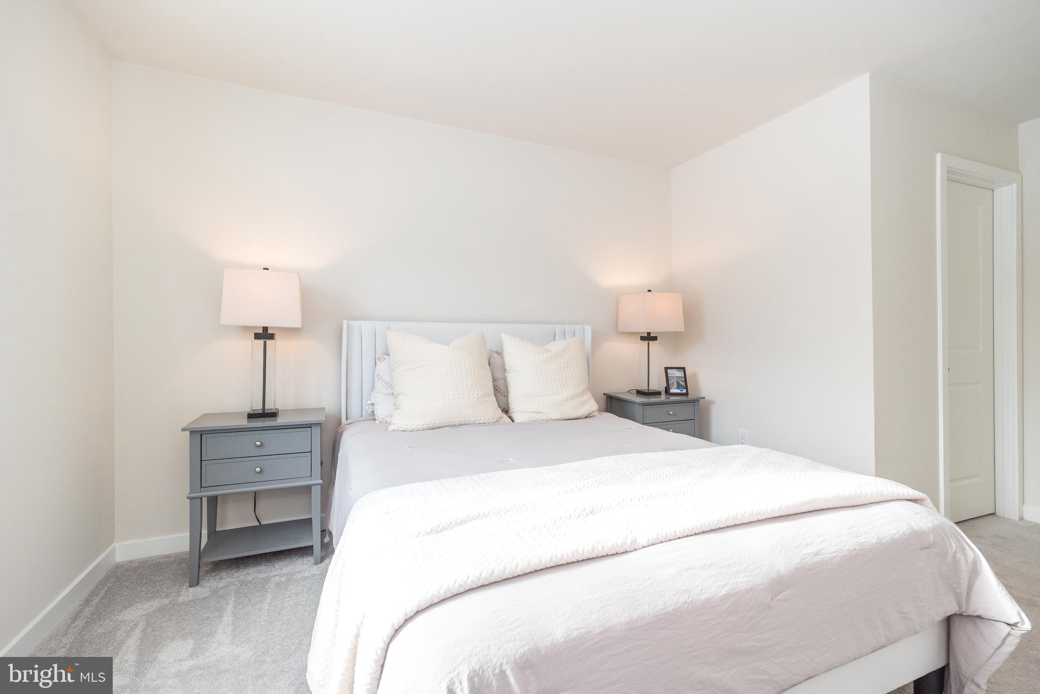 1033 Mariwill Drive Quakertown, PA 18951 - Photo 60 of 67 a bedroom with a bed and a night stand