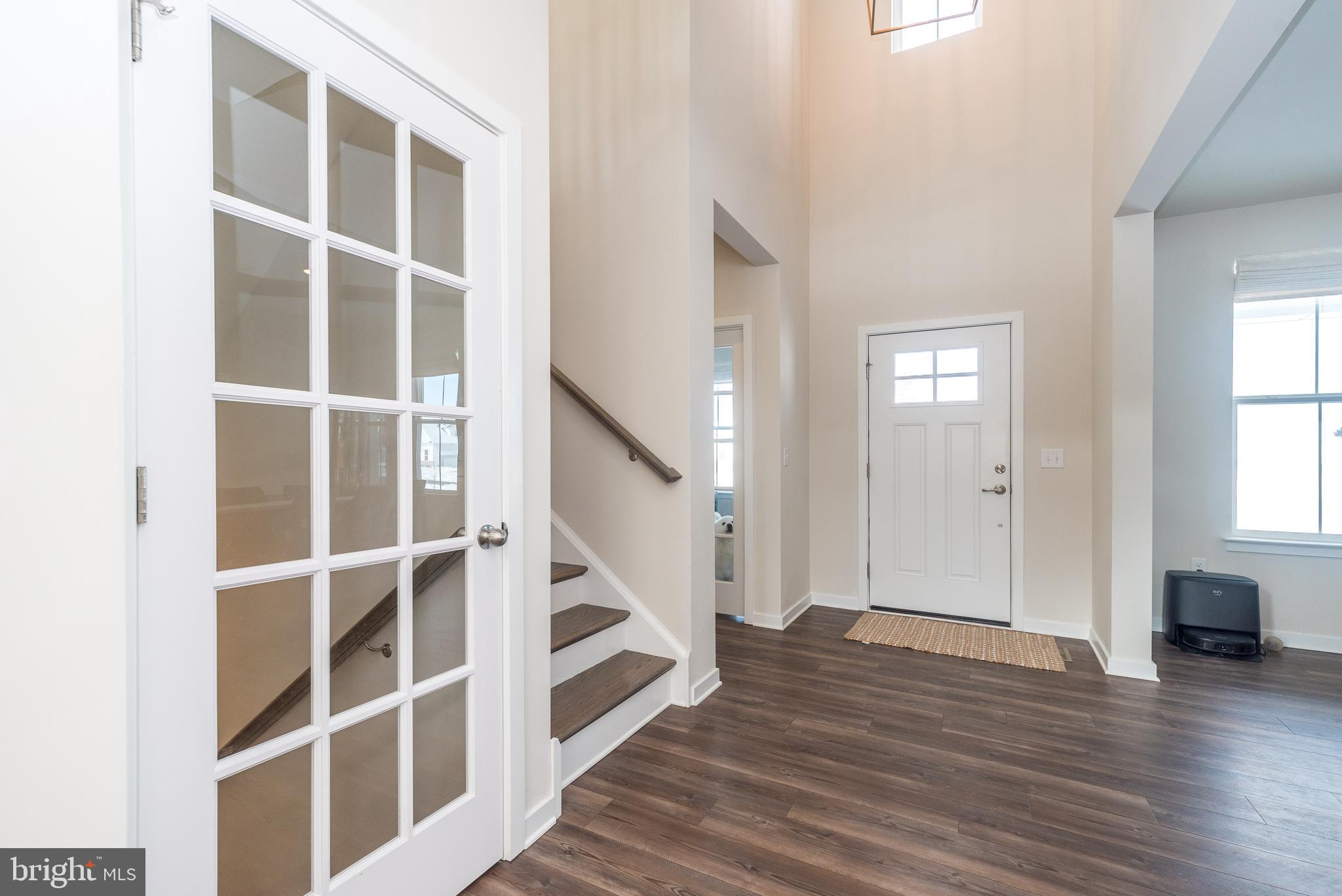 1033 Mariwill Drive Quakertown, PA 18951 - Photo 9 of 67 a view of an empty room with wooden floor and windows