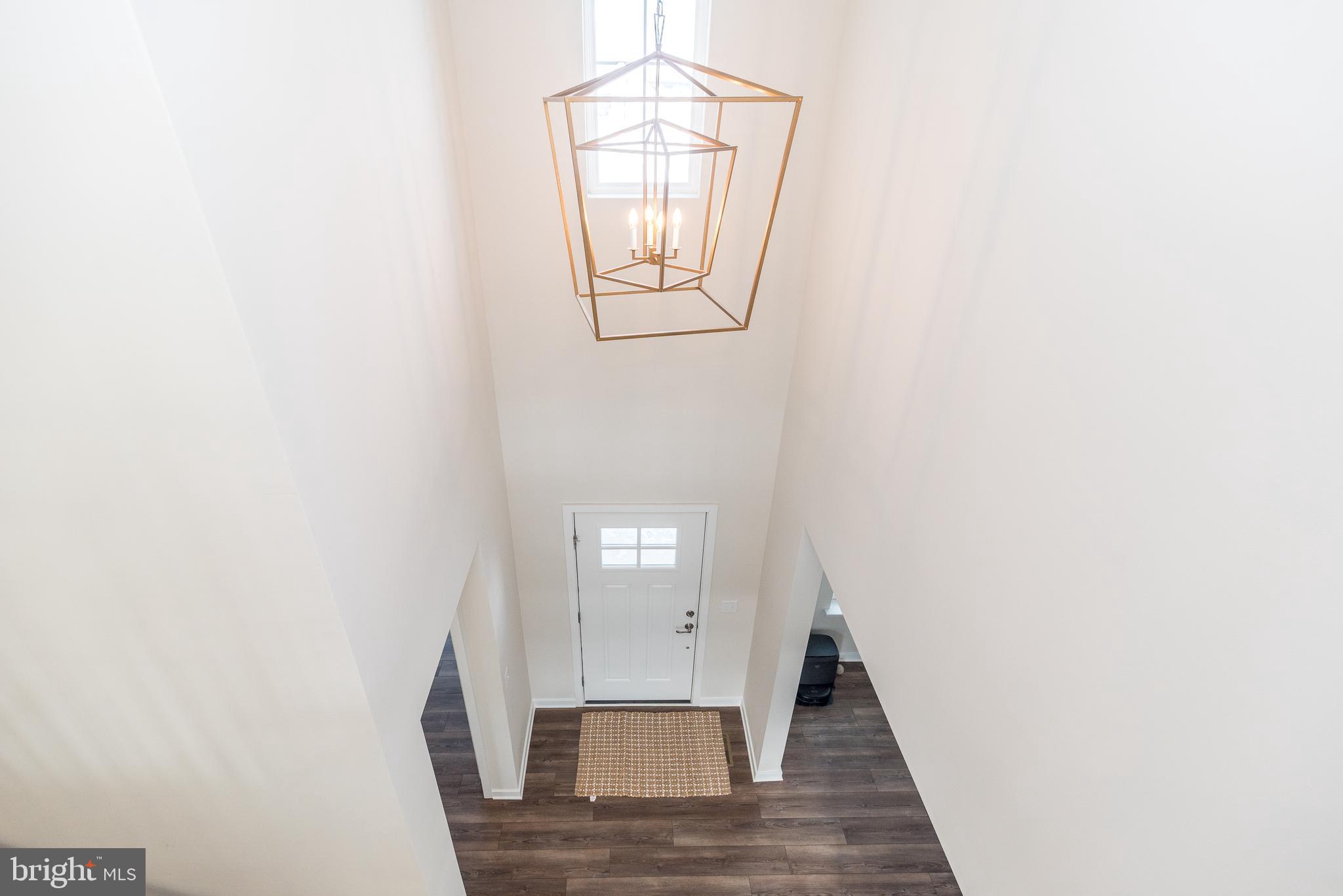 1033 Mariwill Drive Quakertown, PA 18951 - Photo 10 of 67 a view of a hallway with wooden floor and entryway