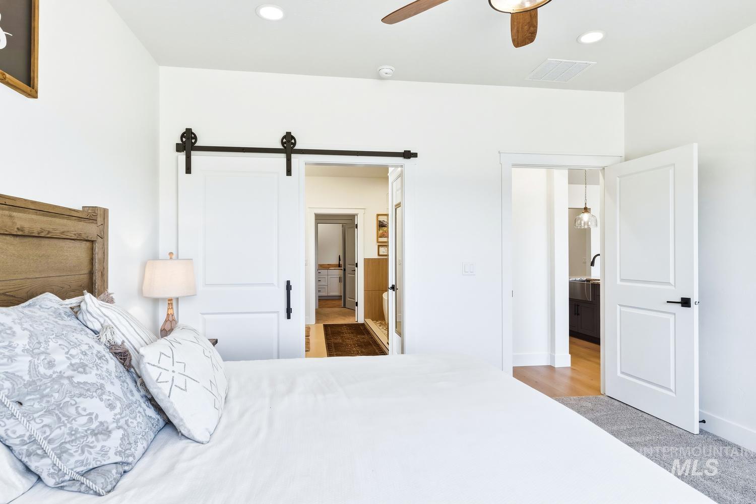 18658 Tranquil Place Caldwell, ID 83607 - Photo 22 of 44 White interior walls with recessed lighting and a ceiling fan