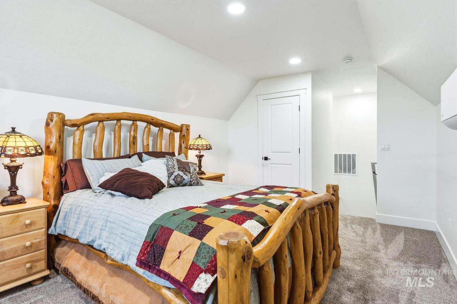 18658 Tranquil Place Caldwell, ID 83607 - Photo 36 of 44 Attic space featuring sloped ceilings, recessed lighting, and grey carpet flooring