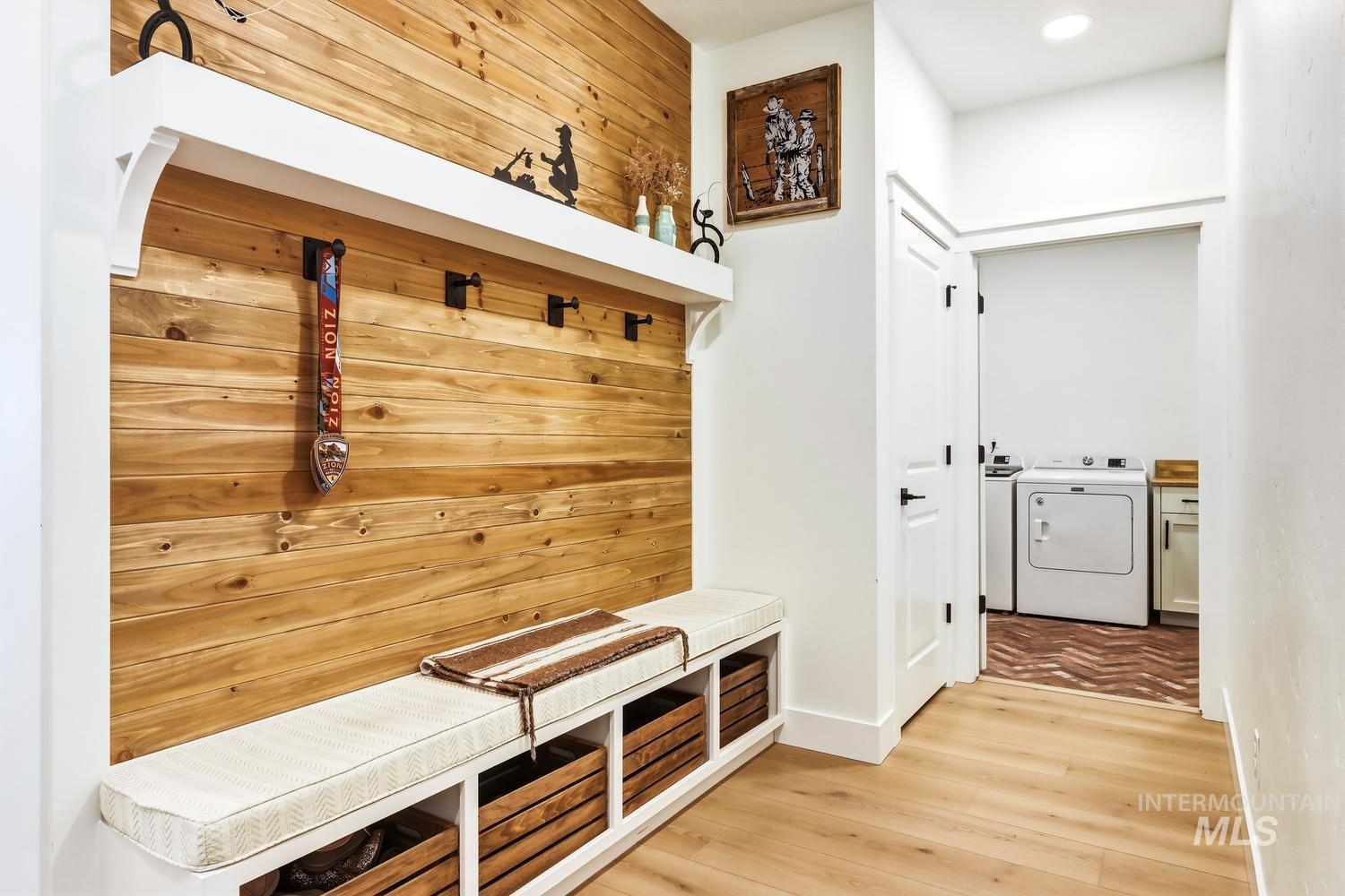 18658 Tranquil Place Caldwell, ID 83607 - Photo 38 of 44 Entryway featuring a wood-panel accent wall and built-in bench with storage cubbies