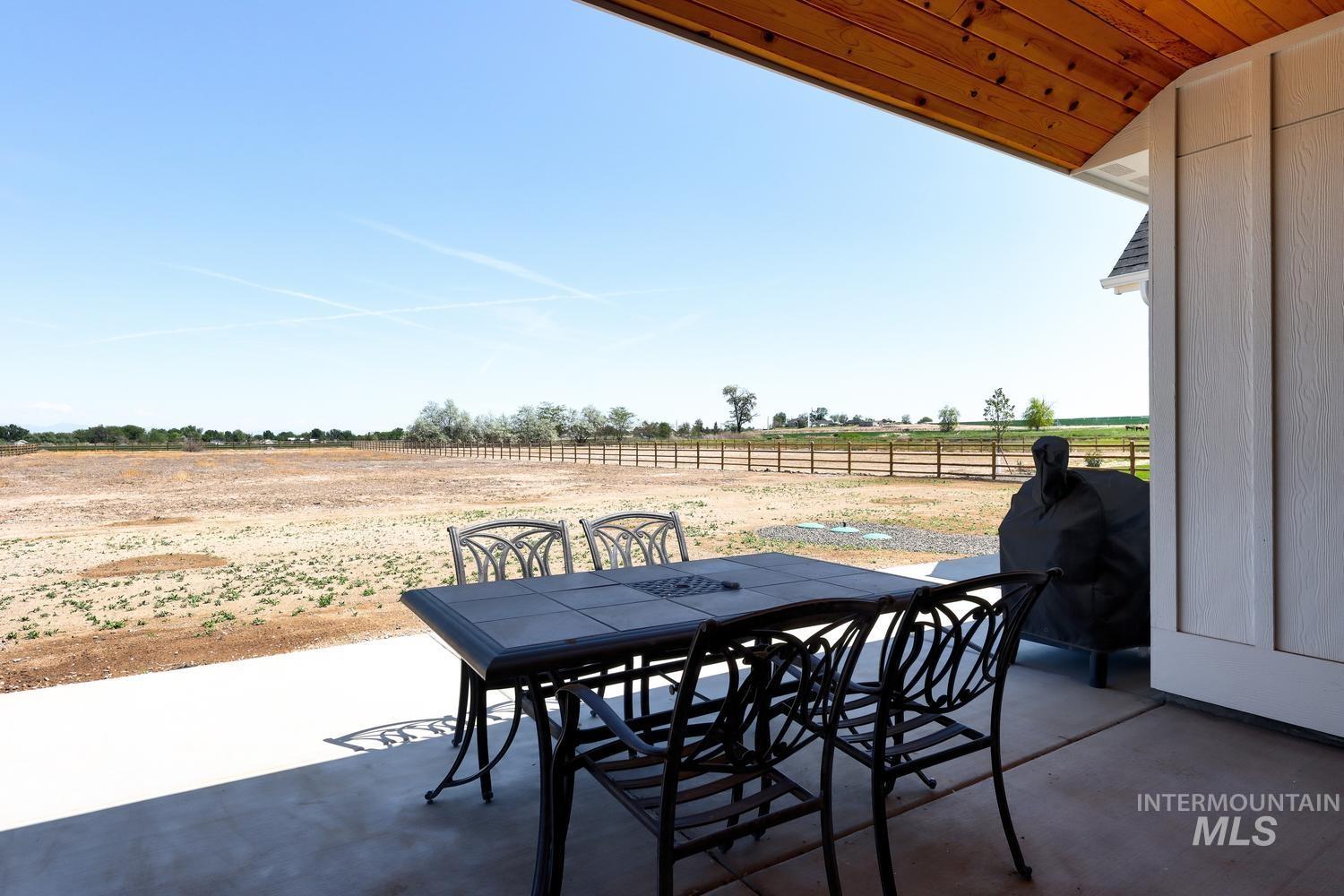 18658 Tranquil Place Caldwell, ID 83607 - Photo 40 of 44 Covered patio with a natural wood-finish ceiling and a large concrete slab