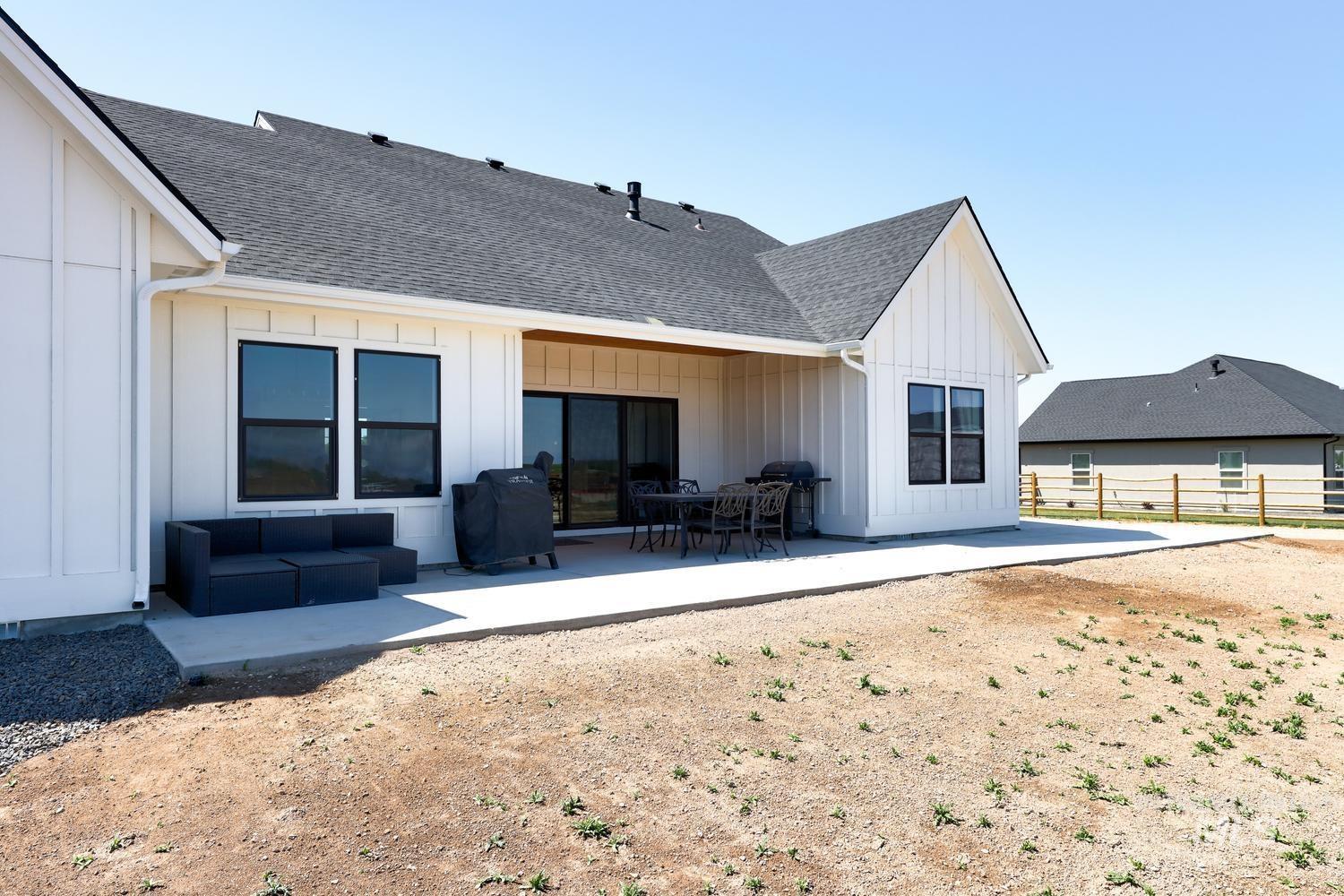 18658 Tranquil Place Caldwell, ID 83607 - Photo 41 of 44 Spacious concrete patio extending along the rear of the residence, offering ample outdoor living space