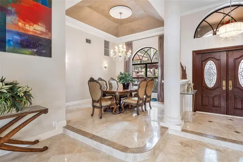 a living room with fireplace furniture and a flat screen tv