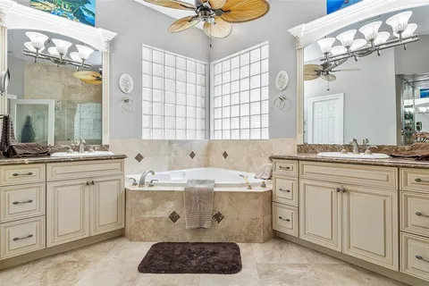 a bathroom with a sink vanity and a mirror