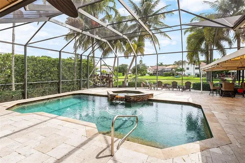 a view of a swimming pool with a patio