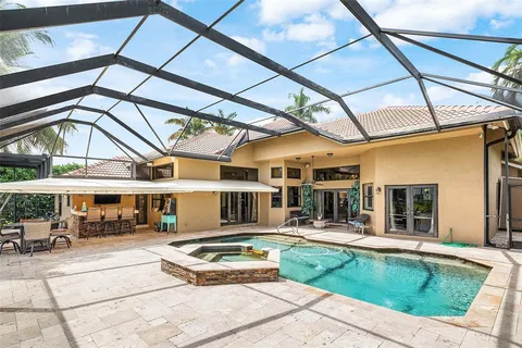 a view of a patio with a table and chairs