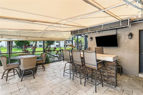 a view of a lake with a table and chairs