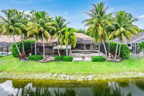 an aerial view of residential houses with yard