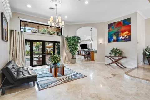 a view of a room with furniture and a potted plant