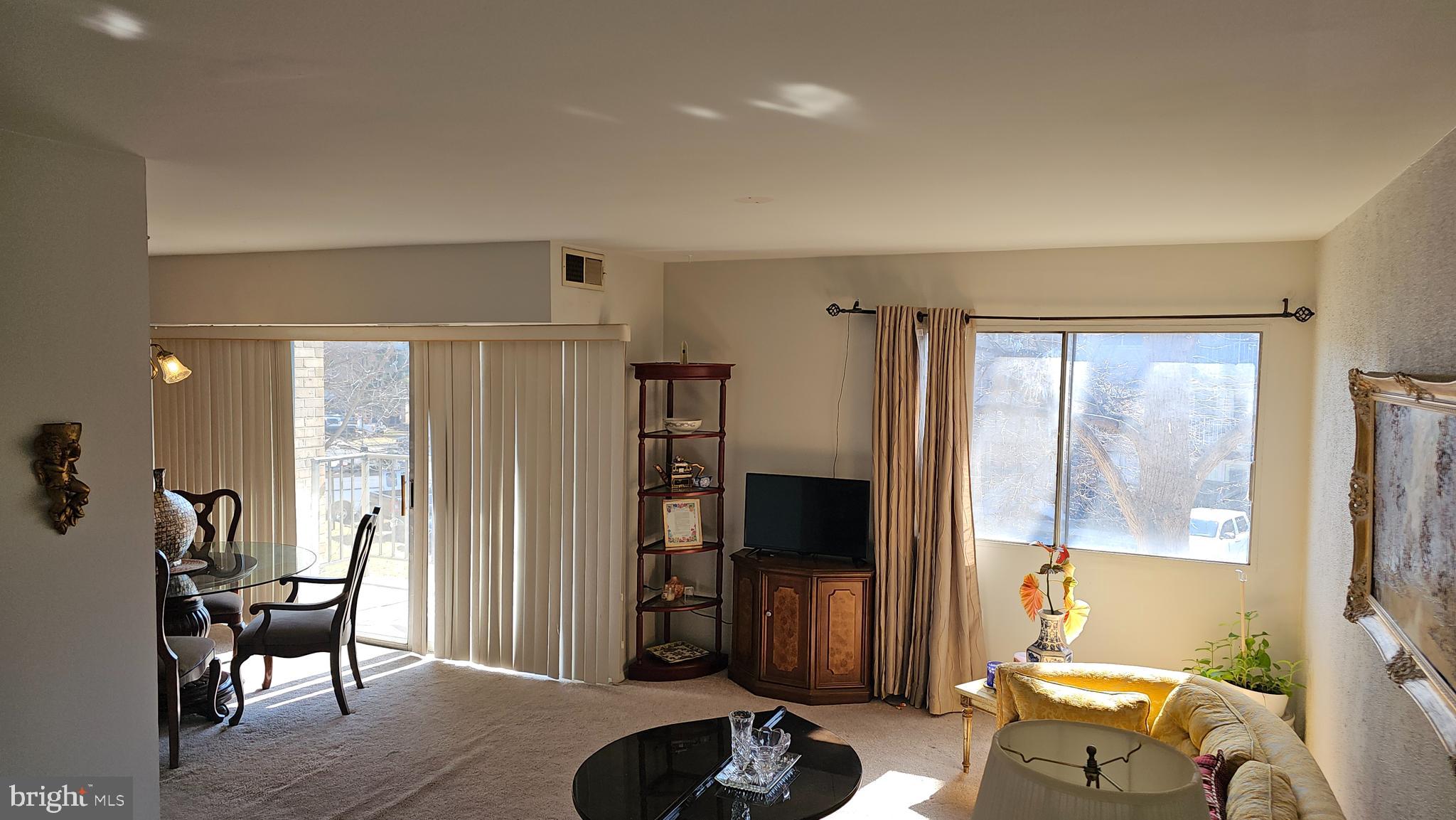 3800 Bel Pre Road, Unit 38005 Silver Spring, MD 20906 - Photo 3 of 42 Living and dining area - walk out to balcony