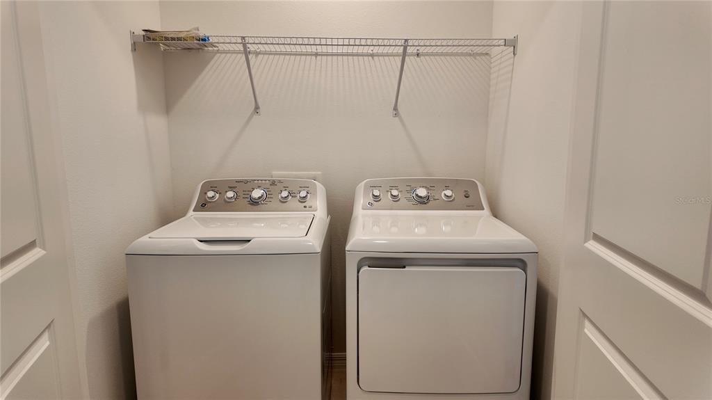 3244 Skyline Loop Kissimmee, FL 34758 - Photo 10 of 13 a utility room with dryer and washer