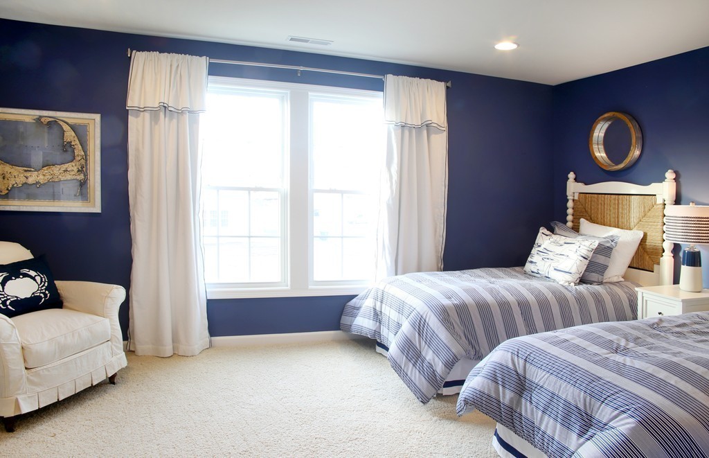4 Locust Lane, Unit 49 Hopkinton, MA 01748 - Photo 11 of 17 a bedroom with two beds and painting on the wall