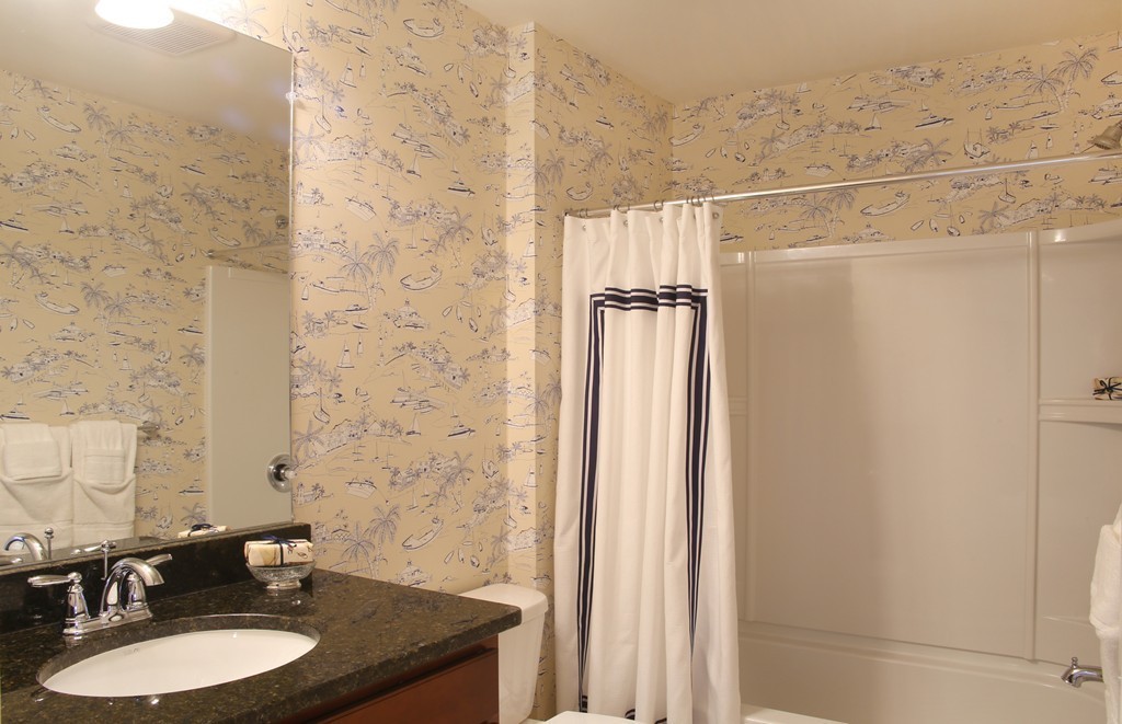 4 Locust Lane, Unit 49 Hopkinton, MA 01748 - Photo 12 of 17 a bathroom with a granite countertop shower and a sink