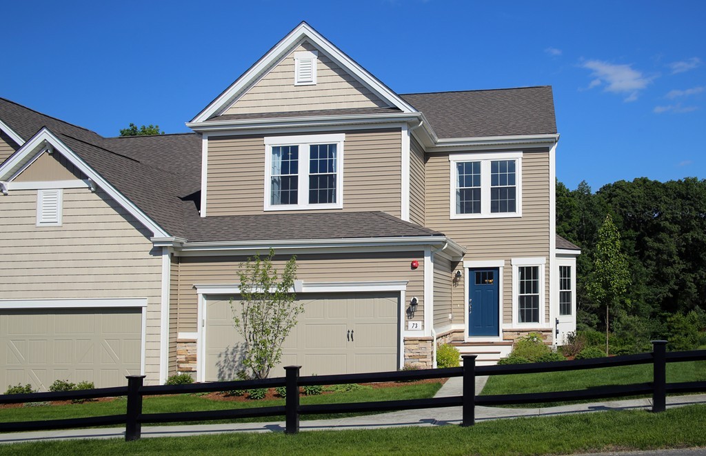 4 Locust Lane, Unit 49 Hopkinton, MA 01748 - Photo 17 of 17 a front view of a house with a yard