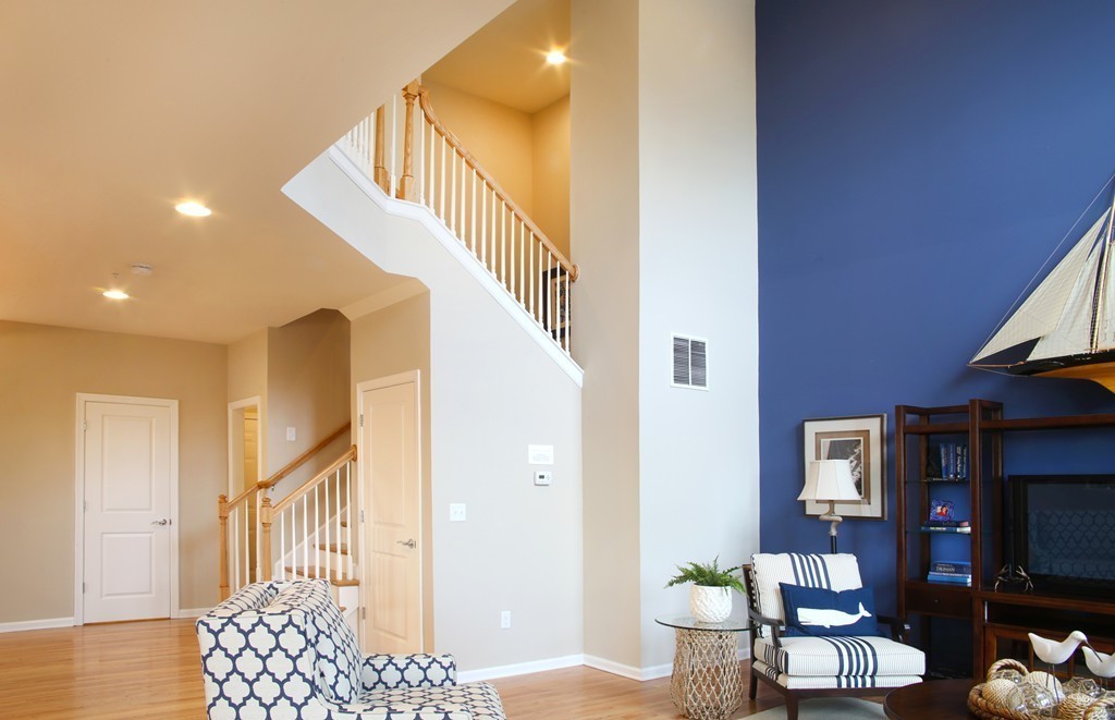 4 Locust Lane, Unit 49 Hopkinton, MA 01748 - Photo 2 of 17 a view of a livingroom with furniture and staircase