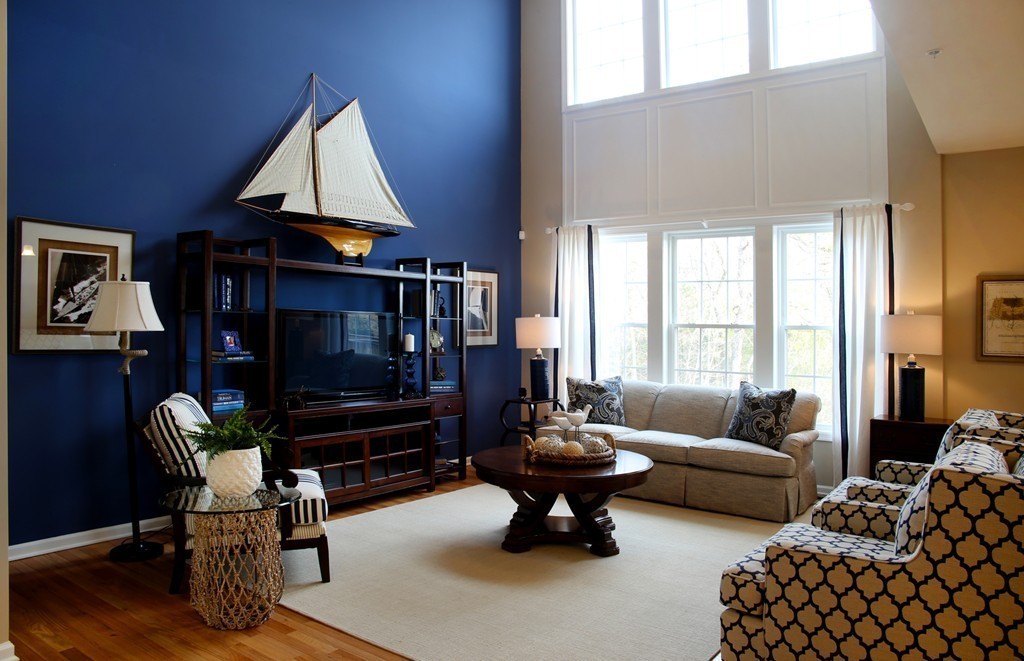 4 Locust Lane, Unit 49 Hopkinton, MA 01748 - Photo 3 of 17 a living room with furniture a rug and a flat screen tv