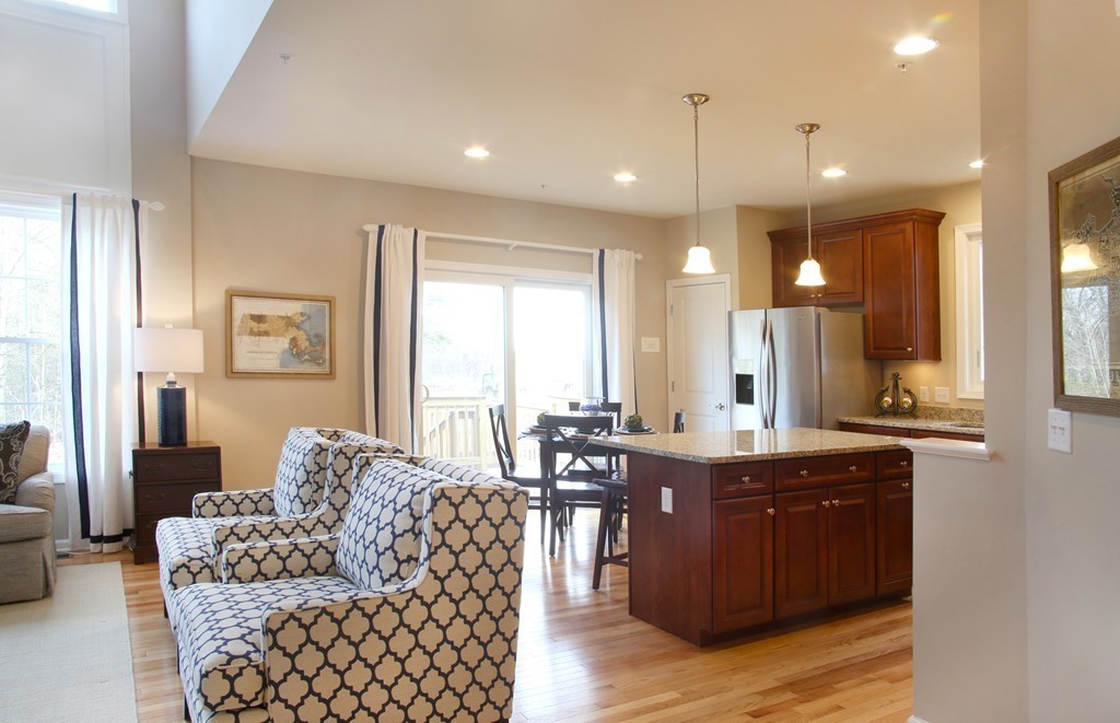 4 Locust Lane, Unit 49 Hopkinton, MA 01748 - Photo 7 of 17 a living room with furniture and a large window