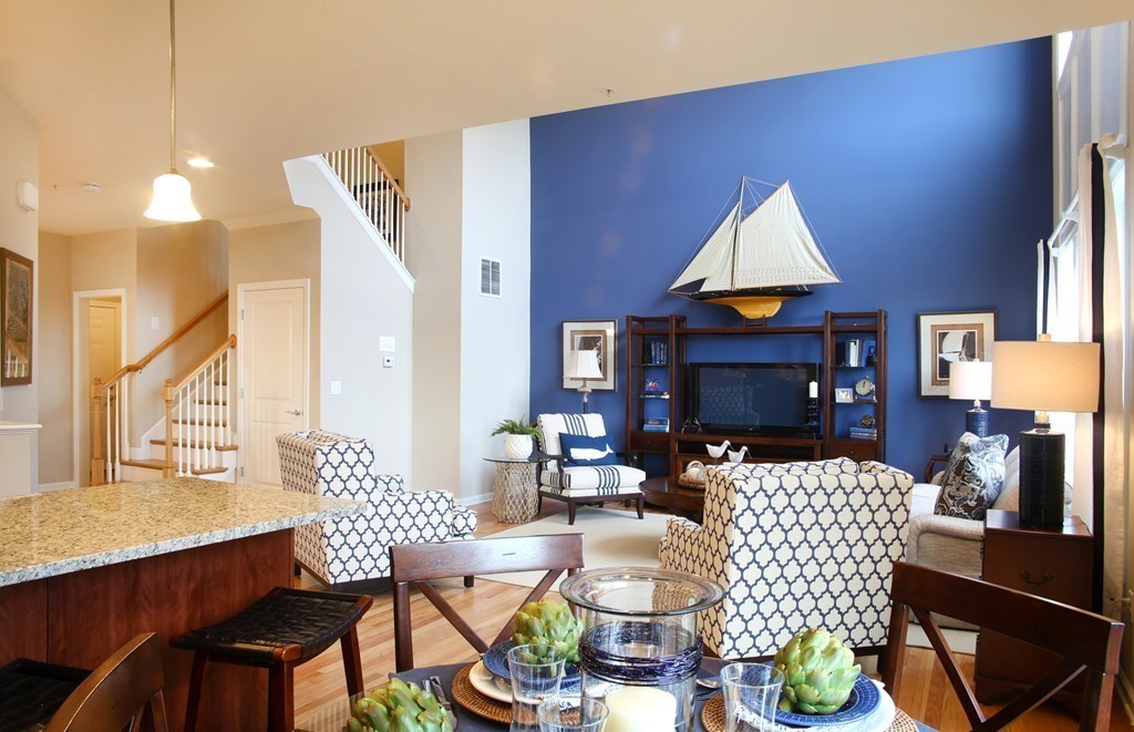 4 Locust Lane, Unit 49 Hopkinton, MA 01748 - Photo 9 of 17 a living room with furniture a window and a lamp